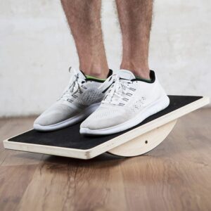 model on wooden balance board