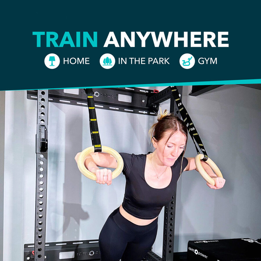 Woman using Wooden Gymnastic Rings Wooden Pair & Feature Text