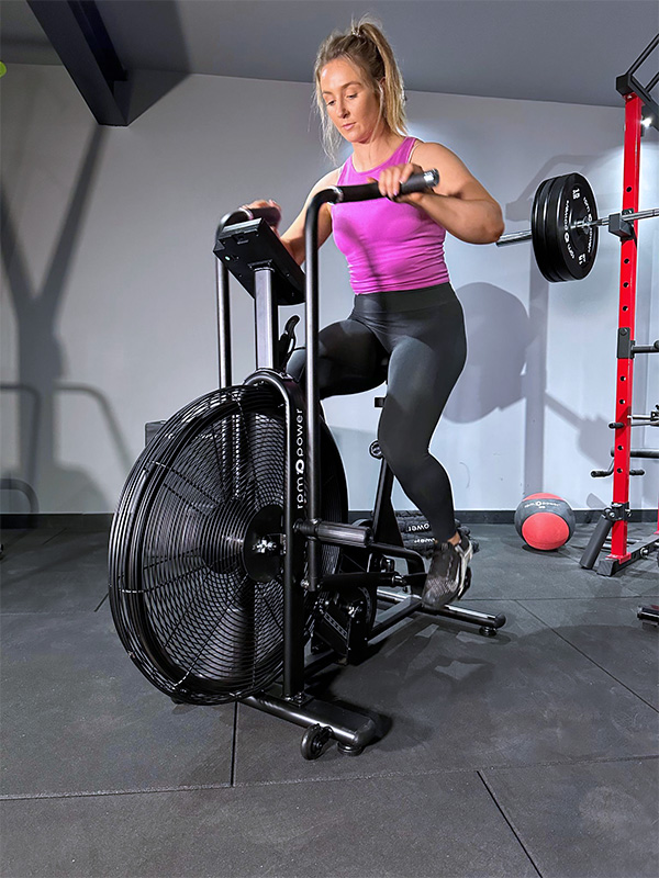 woman using air bike