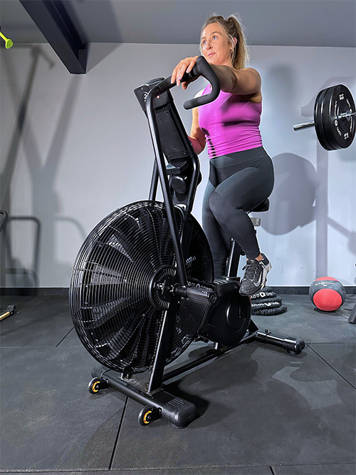 woman using air bike