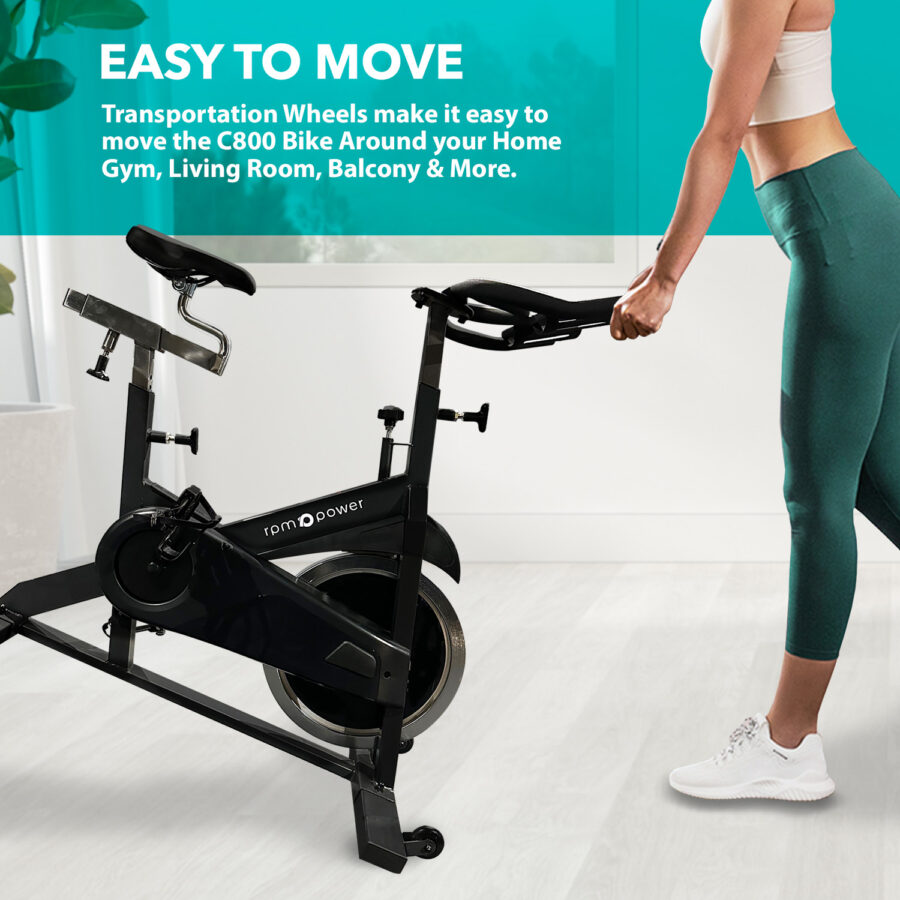 Commercial Spin Bike with woman holding spin bike in home