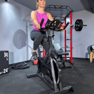 Woman exercising on commercial spin bike