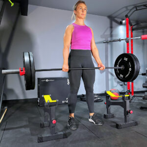 Woman holding Olympic Barbell and Weight Plates above Deadlift Barbell Drop Protector