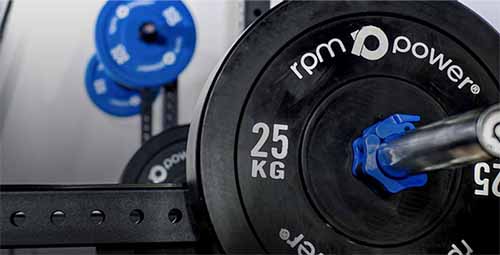 FAQ banner with adjustable squat rack and blue weight plates.