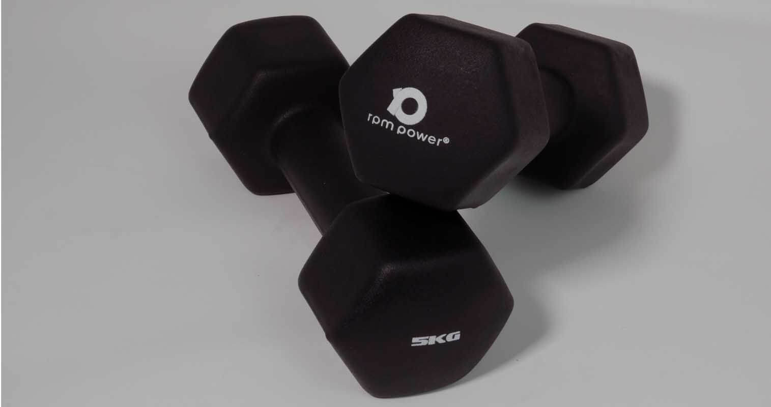 A pair of 5kg neoprene rubber dumbbells against a white background