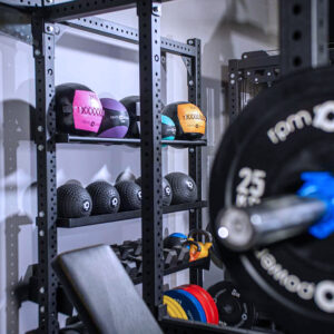 Power Rack with Storage, including a weight bench, dumbbells, kettlebell, weight plates, olympic barbell and wall balls, slam balls and medicine balls
