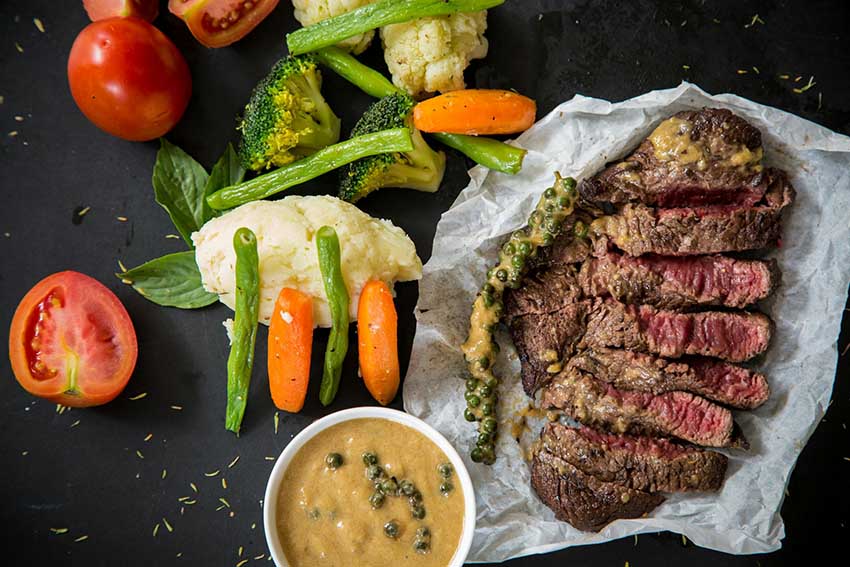 Selection of foods that are high in protein, including steak.