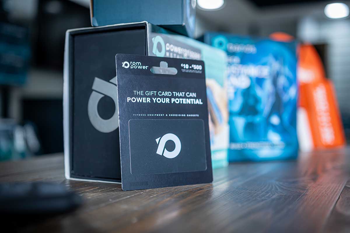The RPM Power gift card in front of RPM Power resistance bands