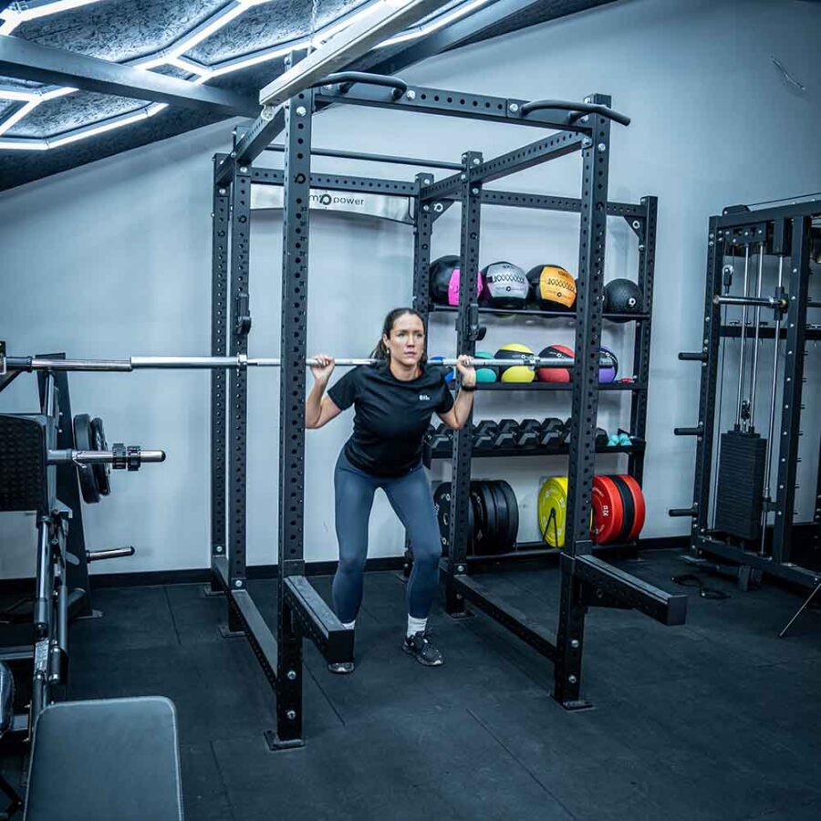 Woman Using Squat RACK