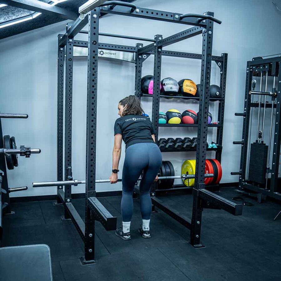Woman Using Squat RACK