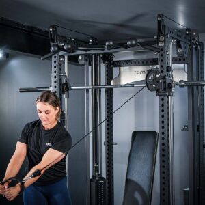 Woman using Multi-Gym with Cable Machine, Smith Bar & Pull-Up BAR
