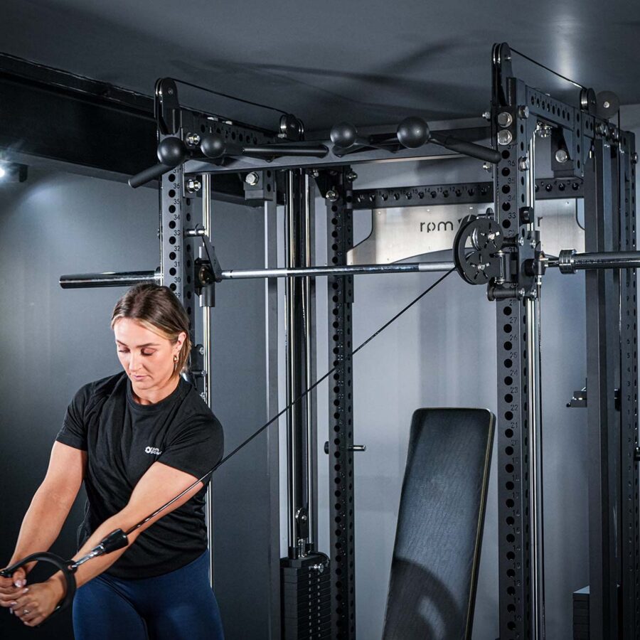 Woman using Multi-Gym with Cable Machine, Smith Bar & Pull-Up BAR