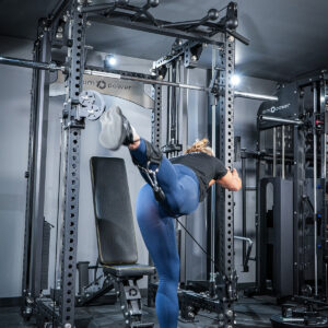 Woman using Multi-Gym with Cable Machine, Smith Bar & Pull-Up BAR