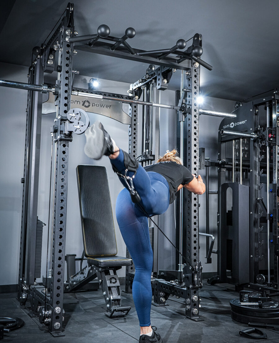 Woman using Multi-Gym with Cable Machine, Smith Bar & Pull-Up BAR