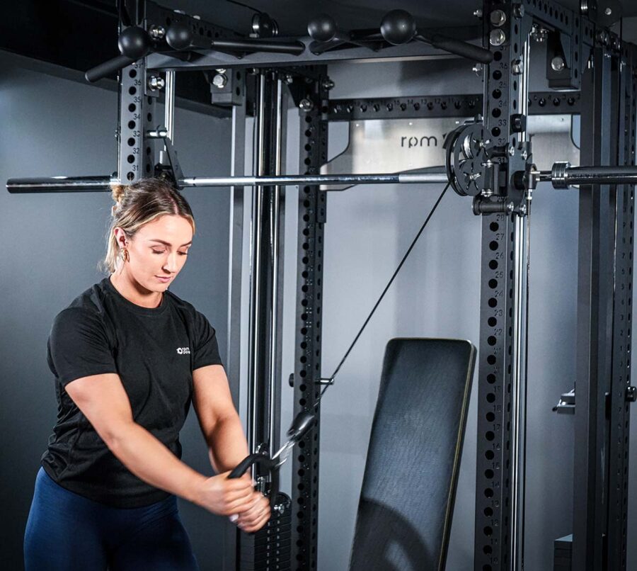 Woman using Multi-Gym with Cable Machine, Smith Bar & Pull-Up BAR