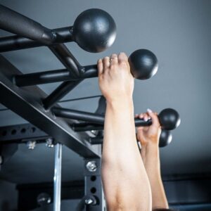 Woman using Multi-Gym with Cable Machine, Smith Bar & Pull-Up BAR