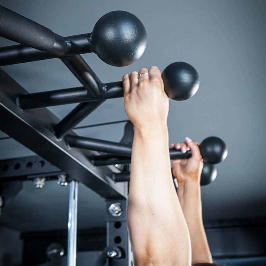 Woman using Multi-Gym with Cable Machine, Smith Bar & Pull-Up BAR