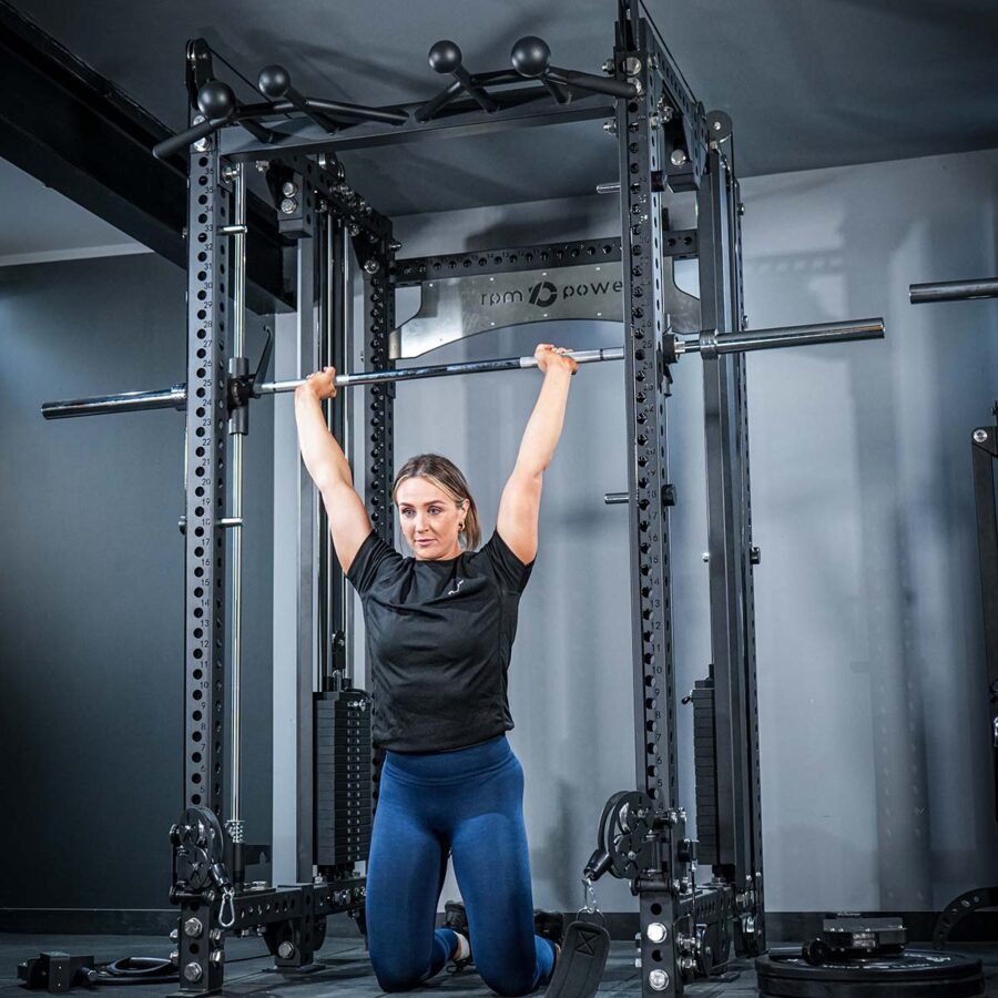 Woman using Multi-Gym with Cable Machine, Smith Bar & Pull-Up BAR