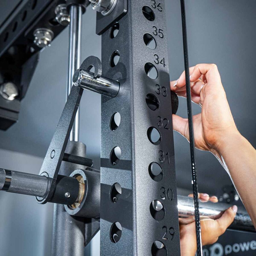 Woman using Multi-Gym with Cable Machine, Smith Bar & Pull-Up BAR
