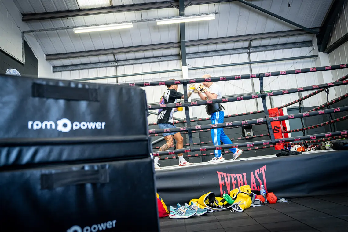 Ben Whittaker sparring with a man in a boxing ring