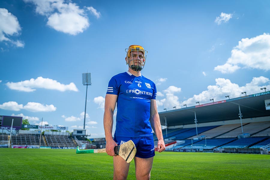 Ronan Maher with a hurley and helmet on a pitch