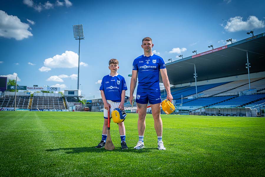 Ronan Maher with a child on a pitch