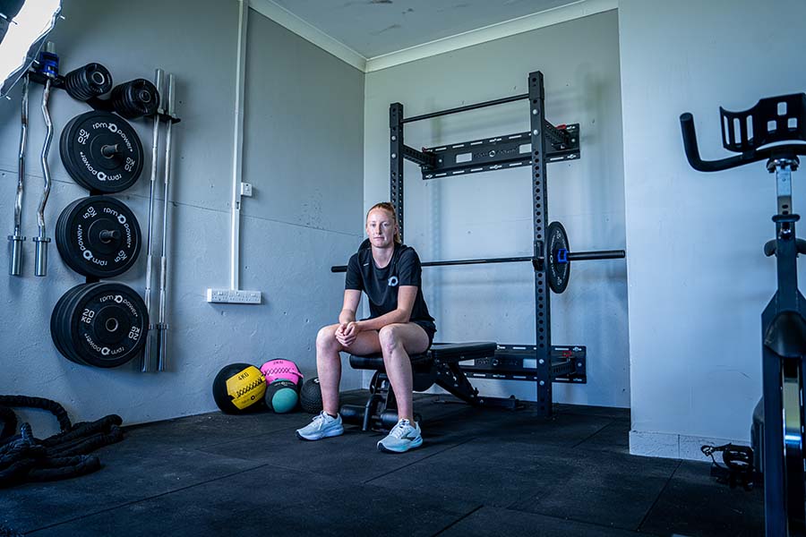 Aishling Moloney sitting on a bench in a gym