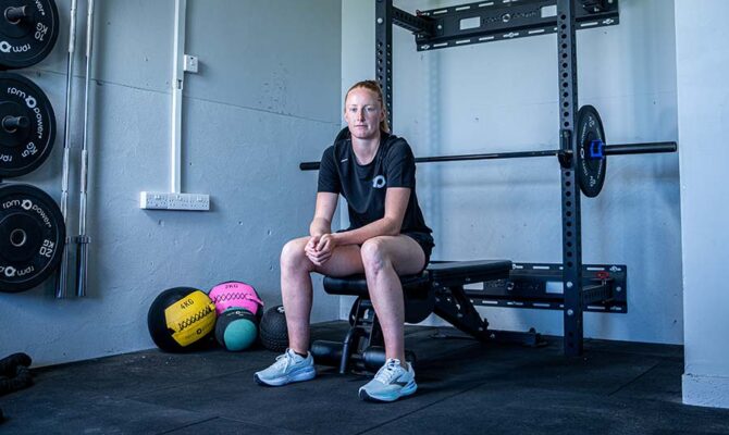 Aishling Moloney sitting on a bench in a gym