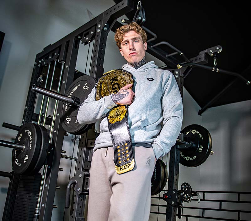 Ciarain Shanahan in a gym with his muay thai belt