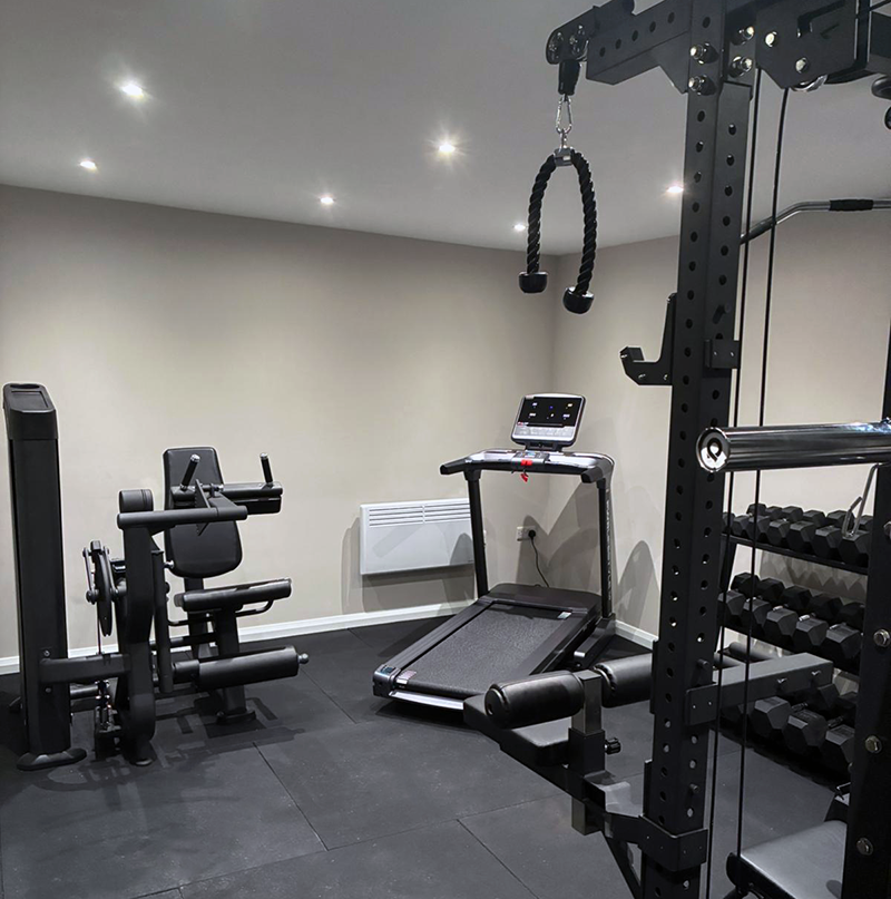 A multi-gym, treadmill and exercise machine in a gym