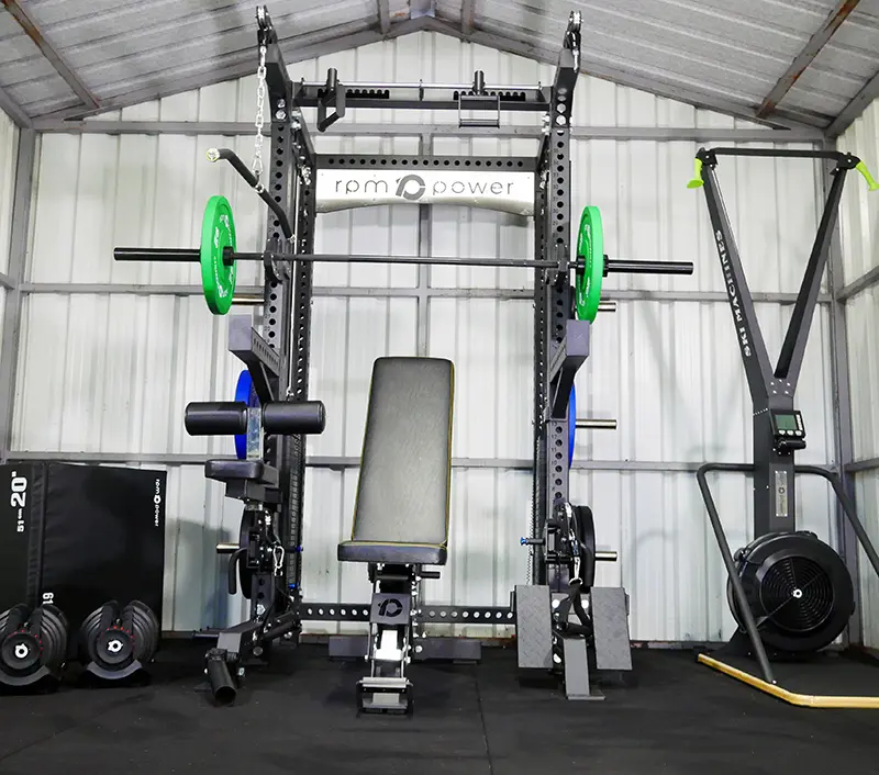 A multi-gym, air ski and dumbbells in a home fitness studio