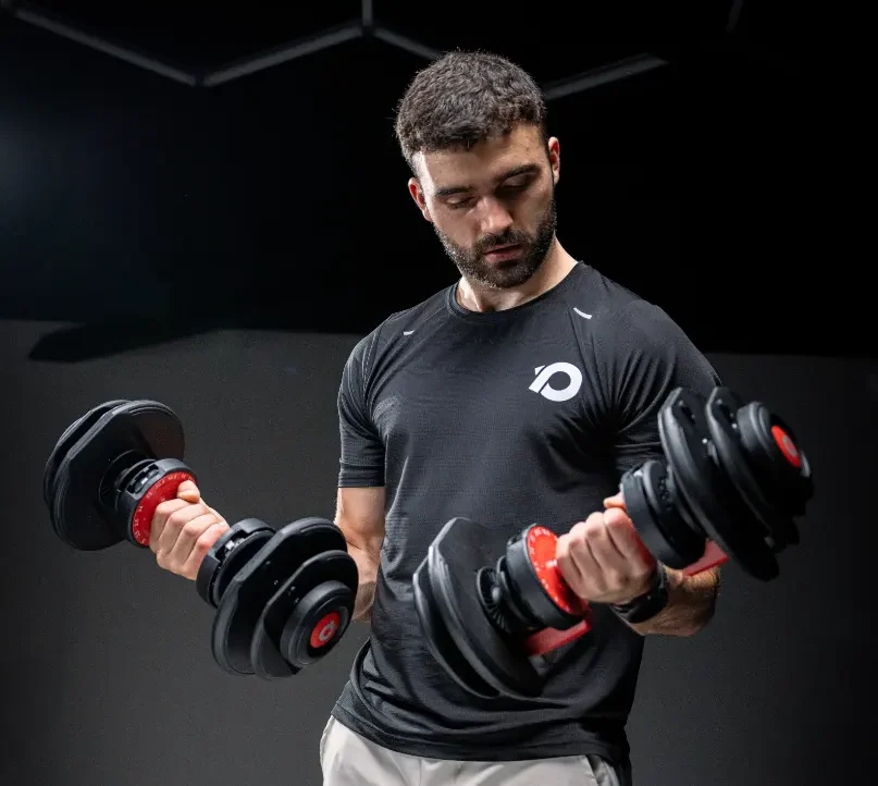 A man using two Adjustable Dumbbells