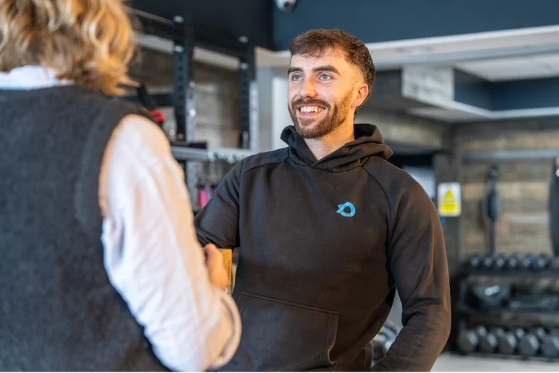 A RPM Power staff member talking to a customer