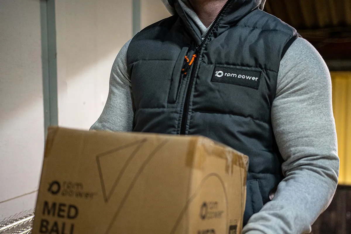 A man holding a RPM Power product in a box