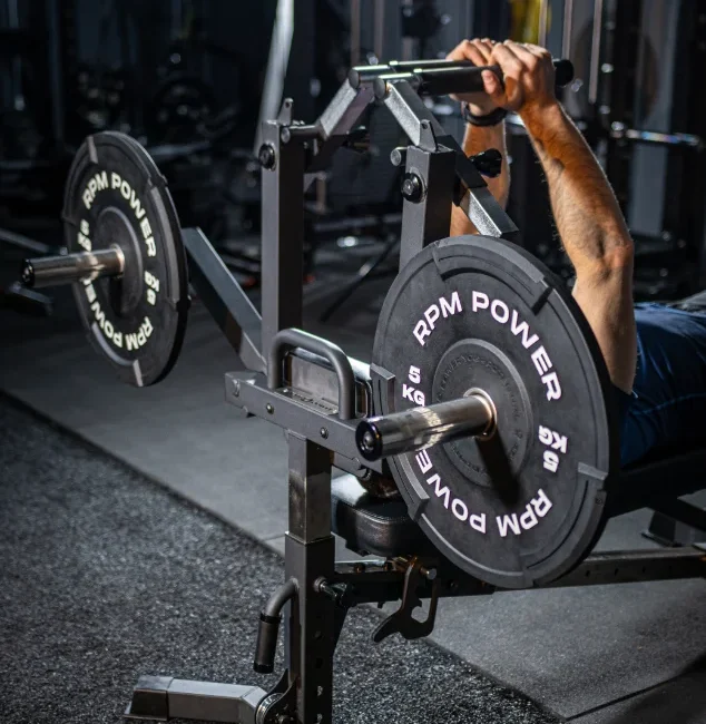 The RPM Power versa Bench being used by a man