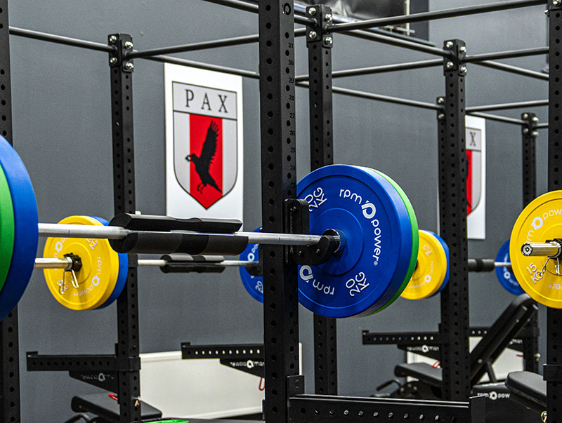 a club logo with RPM Power weight plates in different colours