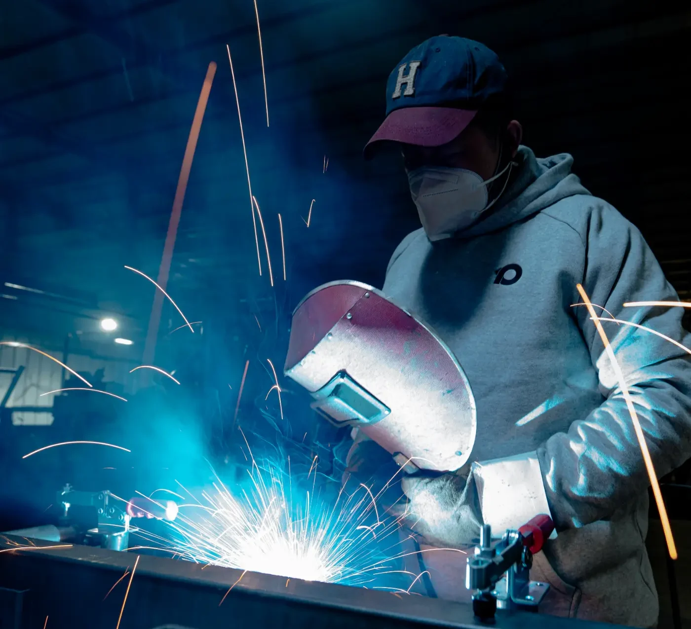A man soldering a piece of metal