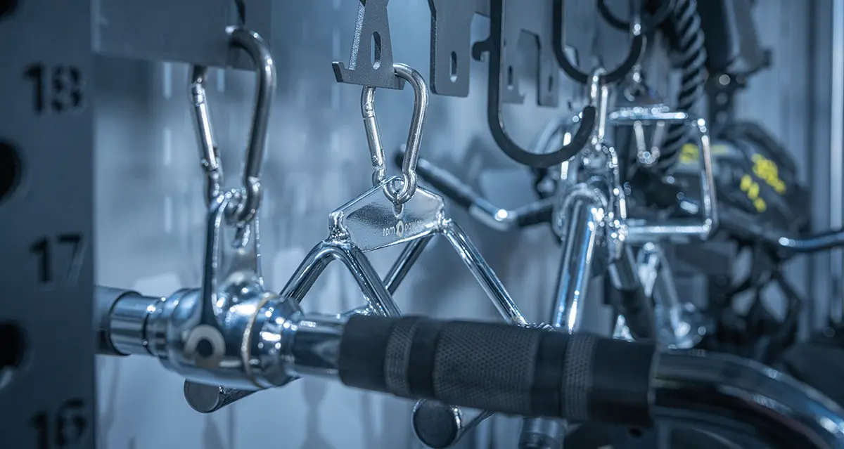 Cable machine attachments on storage rack