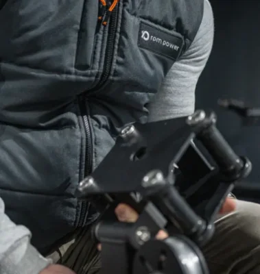 A man with a fitness equipment part in his hand