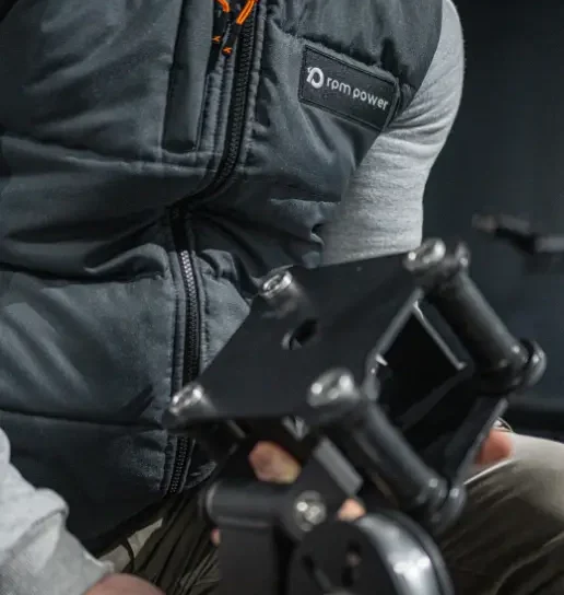 A man with a fitness equipment part in his hand