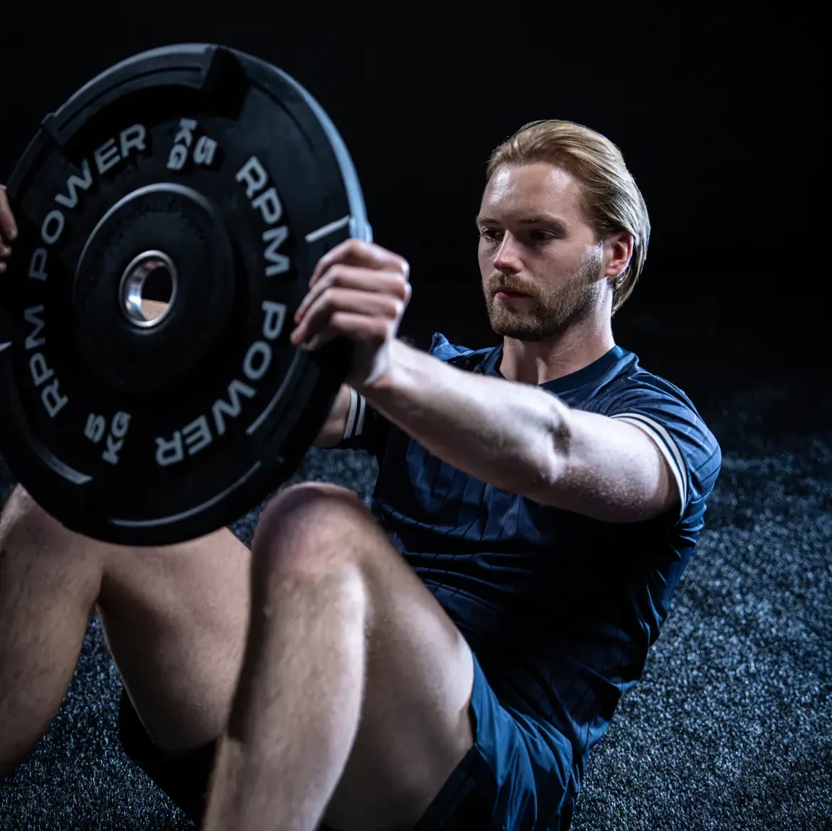 Caoimhin Kelleher with a weight plate