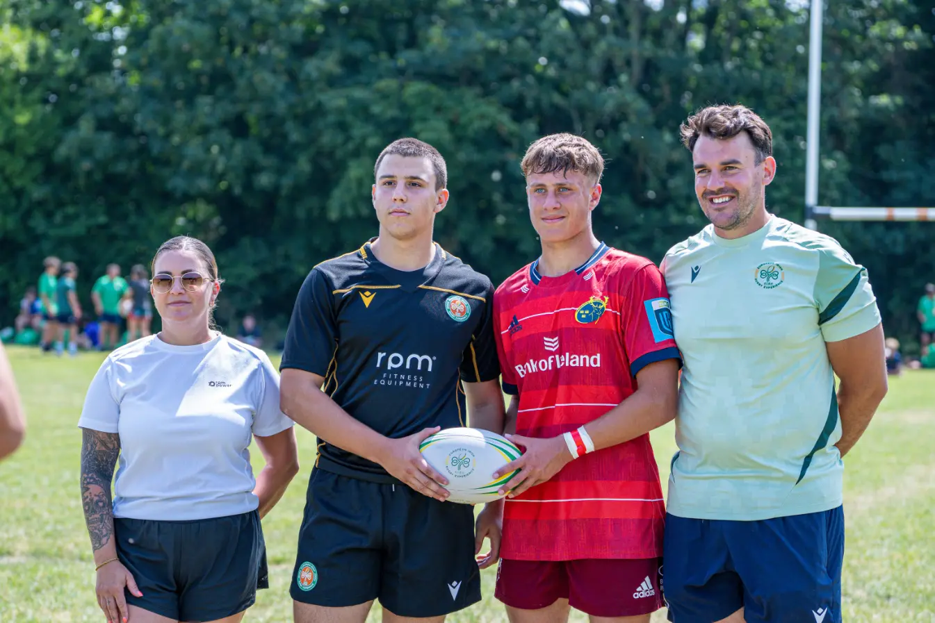 Two rugby players, RPM Power representative and St Munchins representative